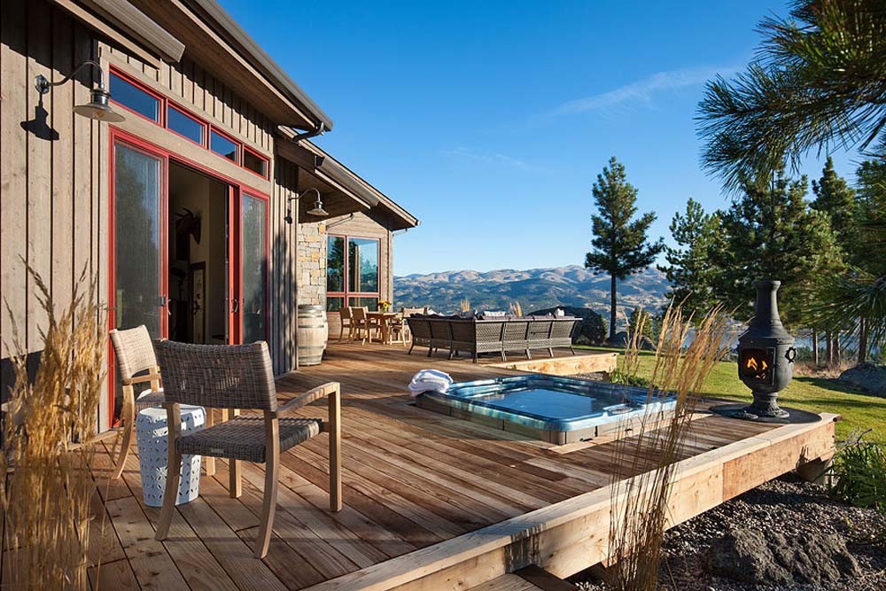 Exterior, horizontal, rear deck with hot tub looking out to mountains and Canyon Ferry Lake view, Fowler residence, Helena, Montana; Boxwoods
