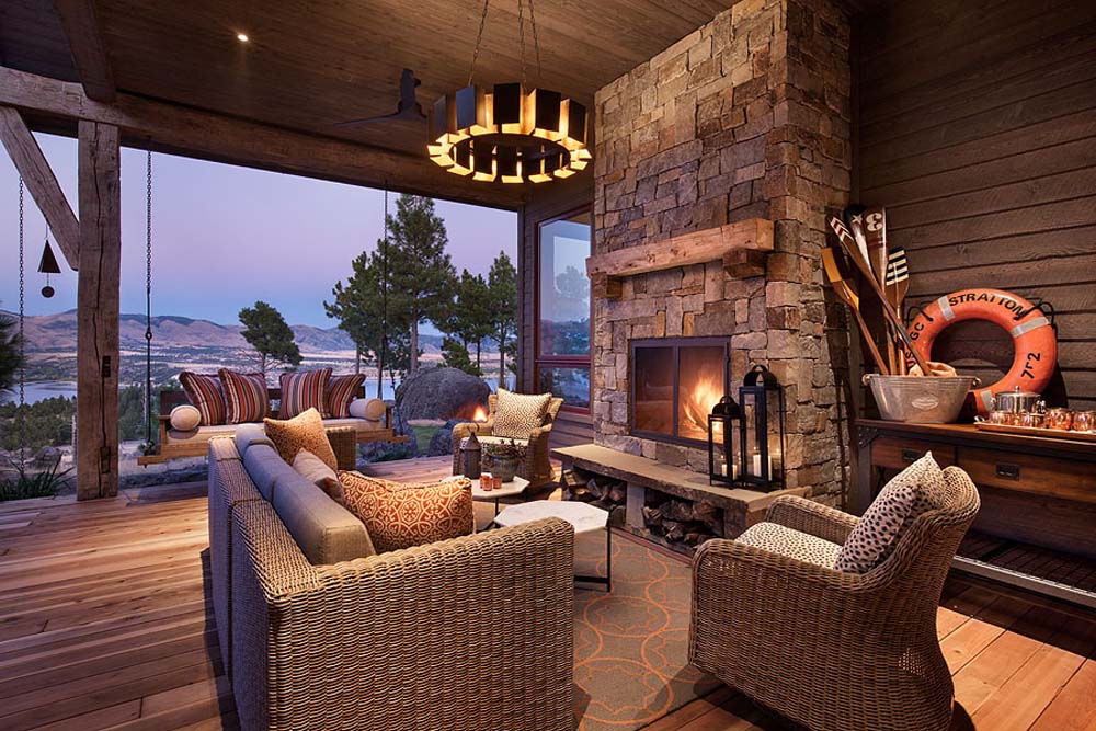 Exterior, horizontal rear covered deck with fireplace looking out to mountains and Canyon Ferry Lake view, Fowler residence, Helena, Montana; Boxwoods